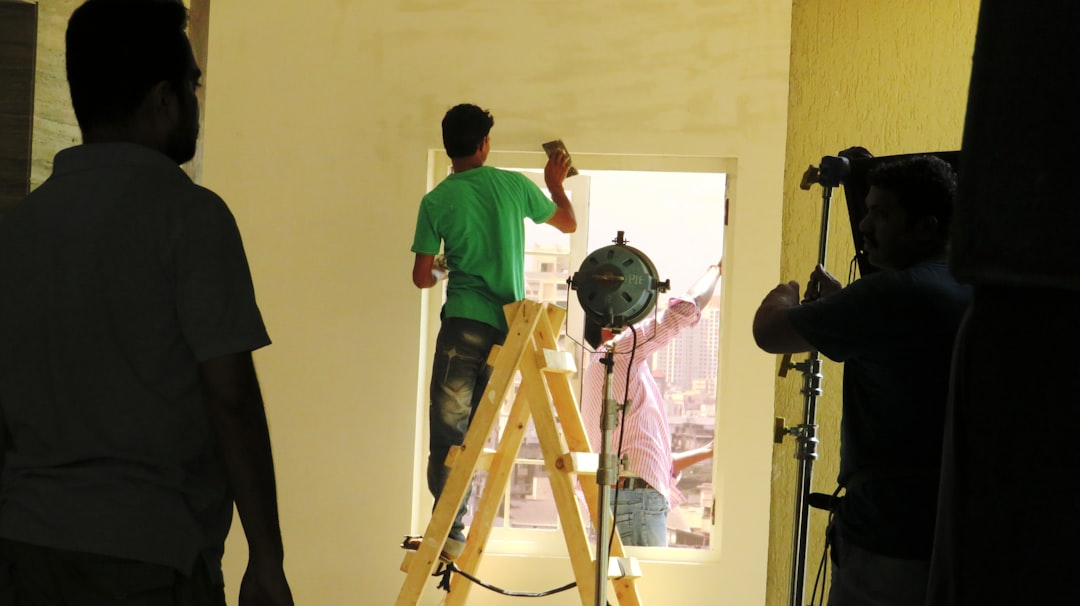A commercial painting contractor consulting with a business owner